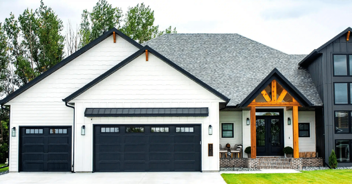 black garage door on a white house
